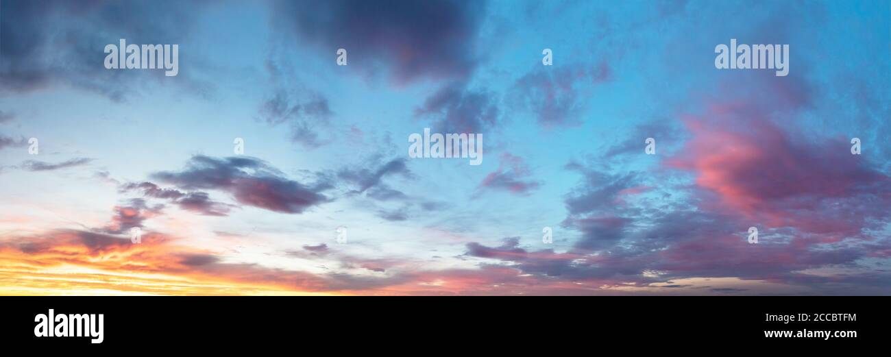 Beautiful sunset cloudy sky with dramatic clouds and sun over horizon ...