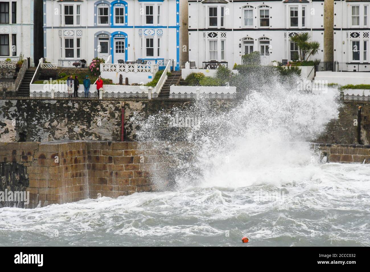 Porthleven, Cornwall, UK.  21st August 2020.  UK Weather.  Huge waves from Storm Ellen smash into the cliffs and coastal defences at Porthleven in Cornwall during the early morning at high tide on a day of gale force winds.   Picture Credit: Graham Hunt/Alamy Live News Stock Photo