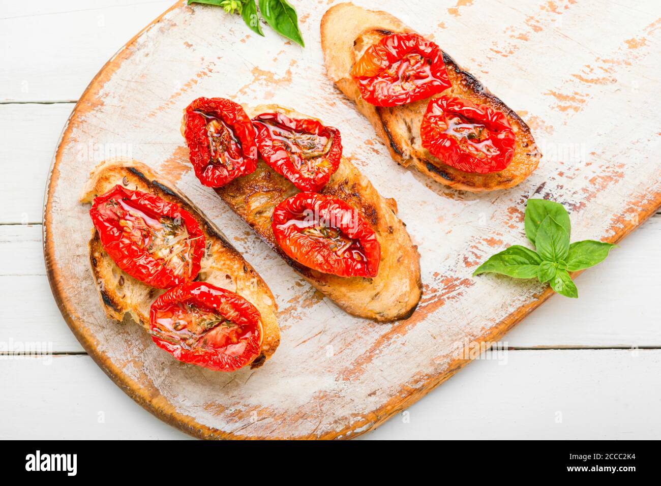 Sandwich with sundried tomatoes and herbs.Italian bruschetta Stock