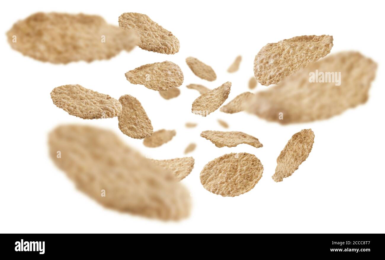 Rice flakes levitate on a white background Stock Photo - Alamy