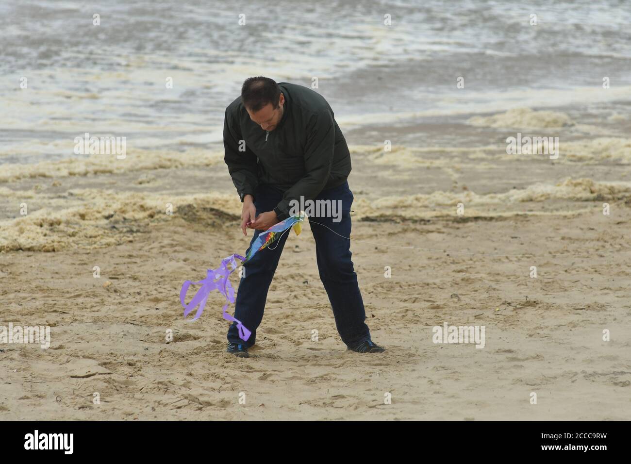 Struggling with wind hi-res stock photography and images - Alamy