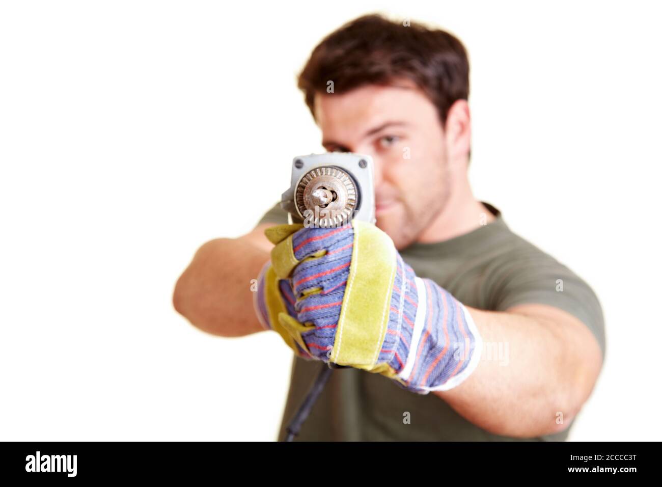 Construction worker with drill drills towards camera Stock Photo Alamy