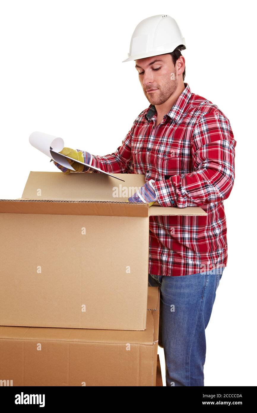 Warehouse worker checks delivery note with checklist on delivery Stock Photo