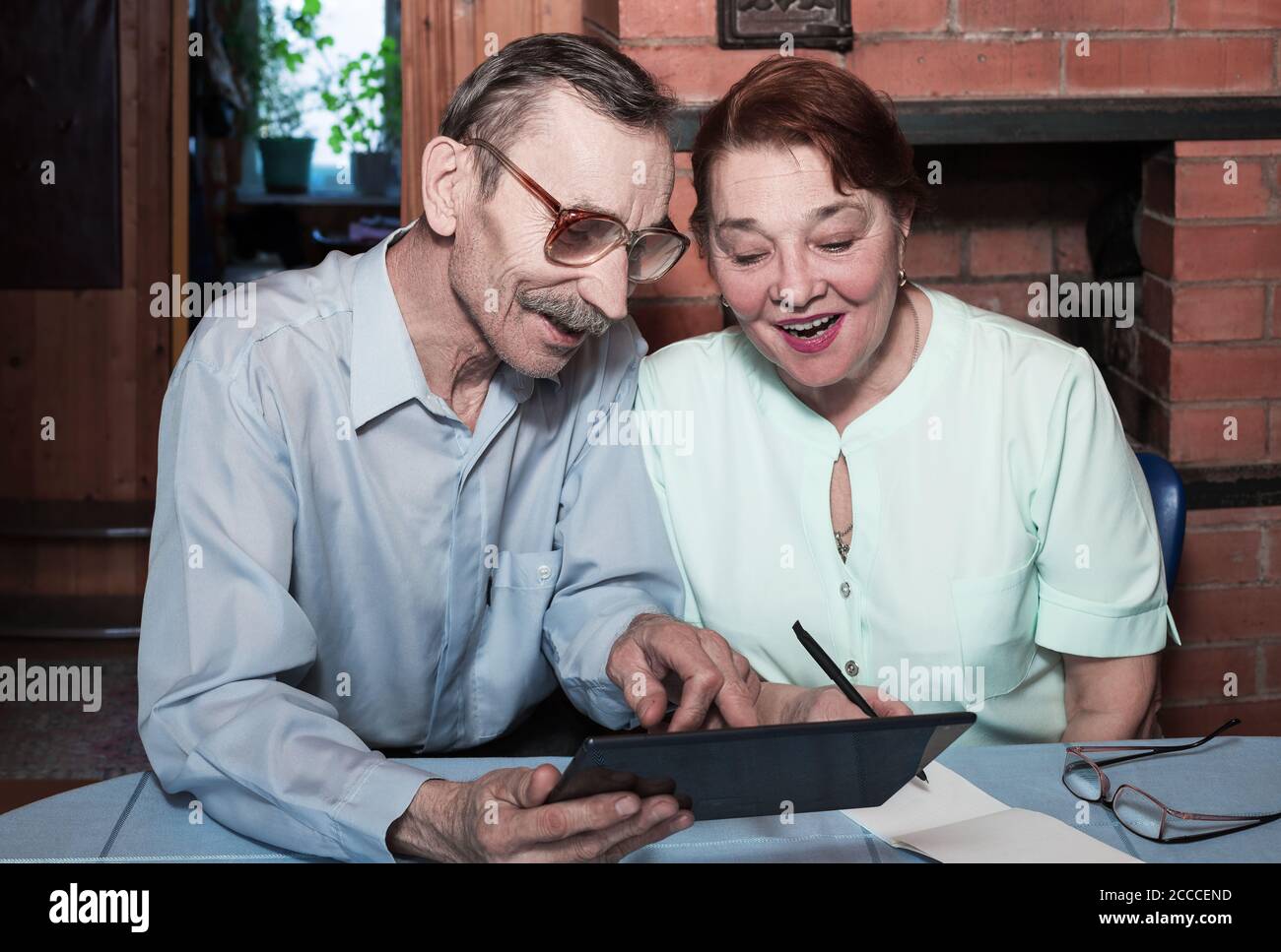 Senior couple and modern technologies. Internet surfing with tablet Stock Photo