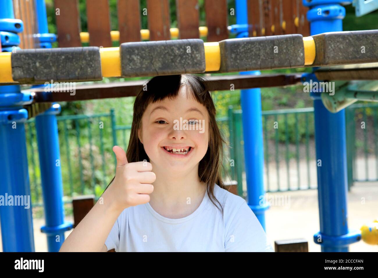 Portrait of little girl smiling in the park Stock Photo - Alamy