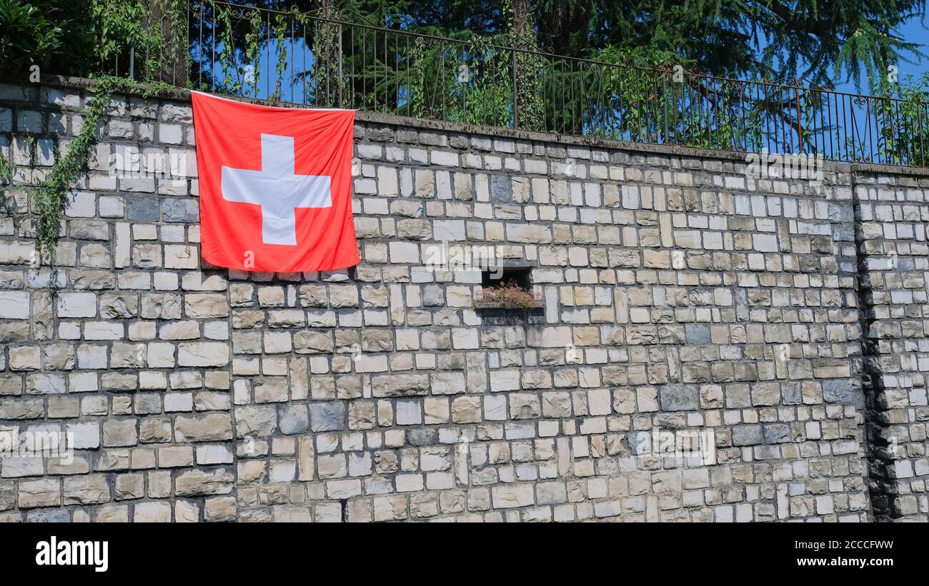 A Swiss flag on a wall. Stock Photo