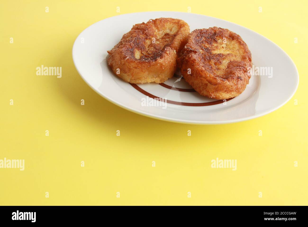 Traditional Spanish torrijas are on a plate Stock Photo