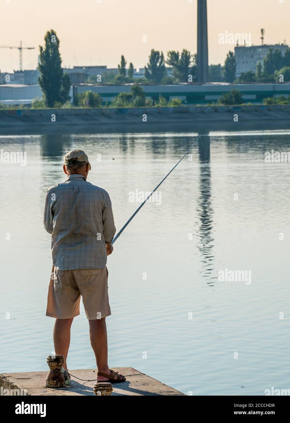 Man fishing in lake edge hi-res stock photography and images - Alamy