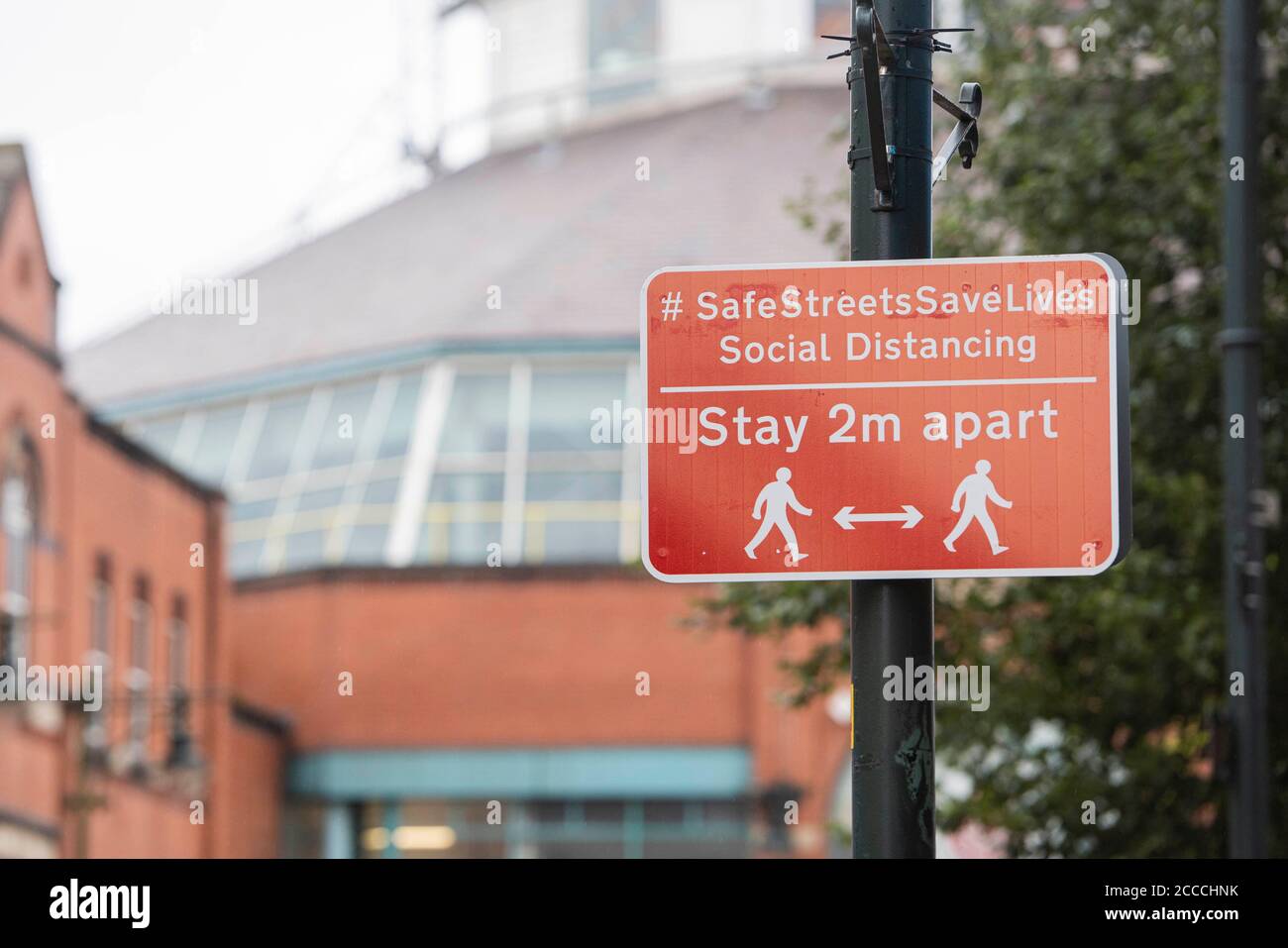 Oldham, UK.  21st Aug 2020  Pictured:  Wet, gloomy start to the day for members of the public in Oldham town centre, which teeters on the edge of lockdown. Credit: Kerry Elsworth/Alamy Live News Stock Photo