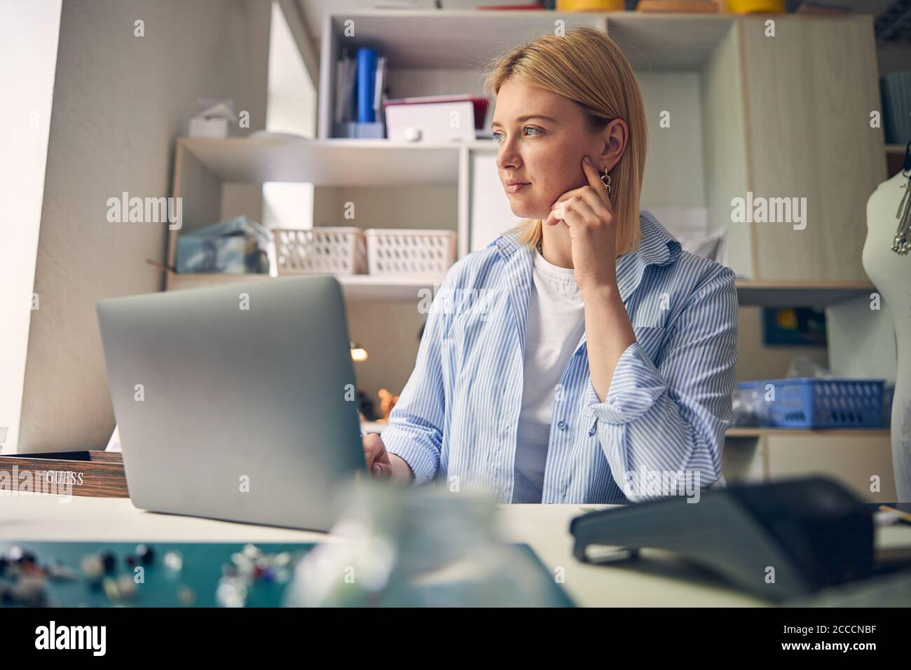 Contemplative glance of experienced employee in work room Stock Photo