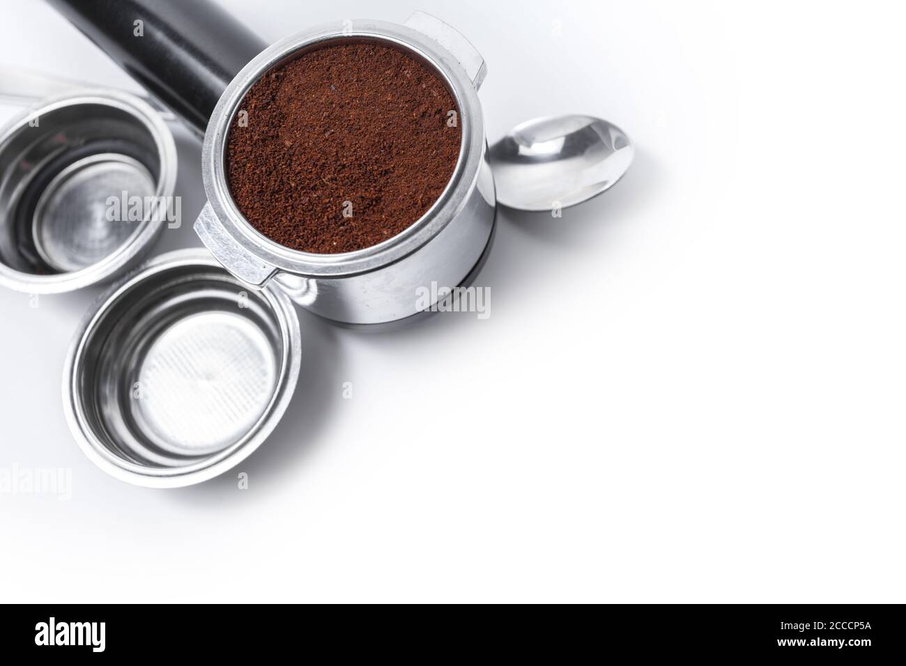 Espresso holder and replaceable coffee filters. The horn from the coffee machine on a white background. Selective focus. High quality photo Stock Photo