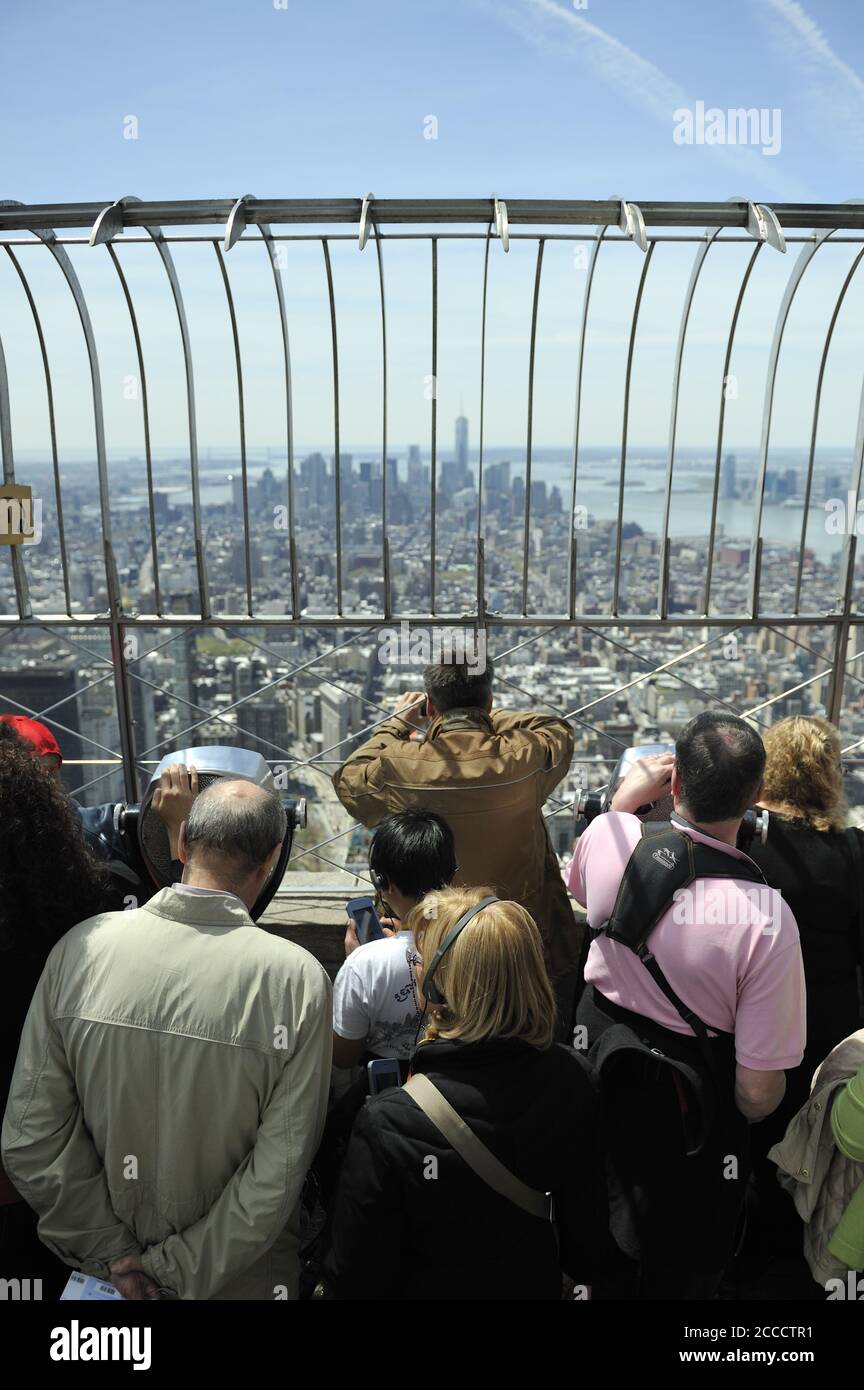 People looking toward Manhattan from the top of the Empire State Building. New York Stock Photo