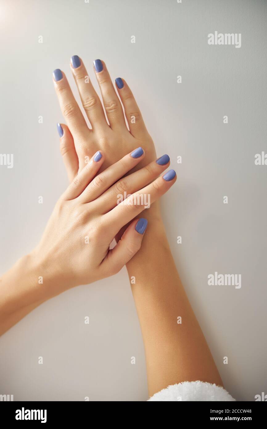 Woman demonstrating fingers with new pretty manicure Stock Photo