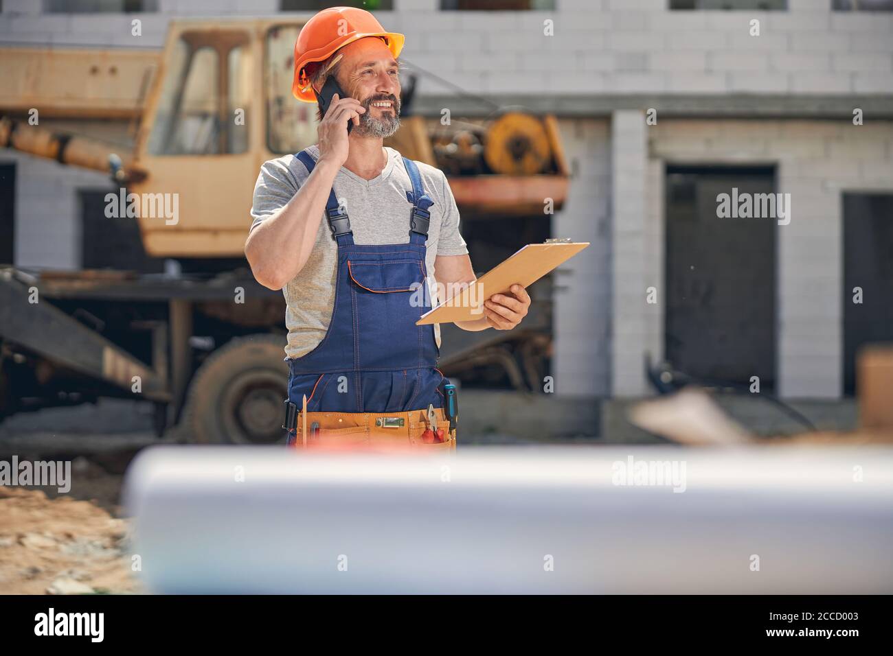 Cheerful mature man calling on his smartphone Stock Photo