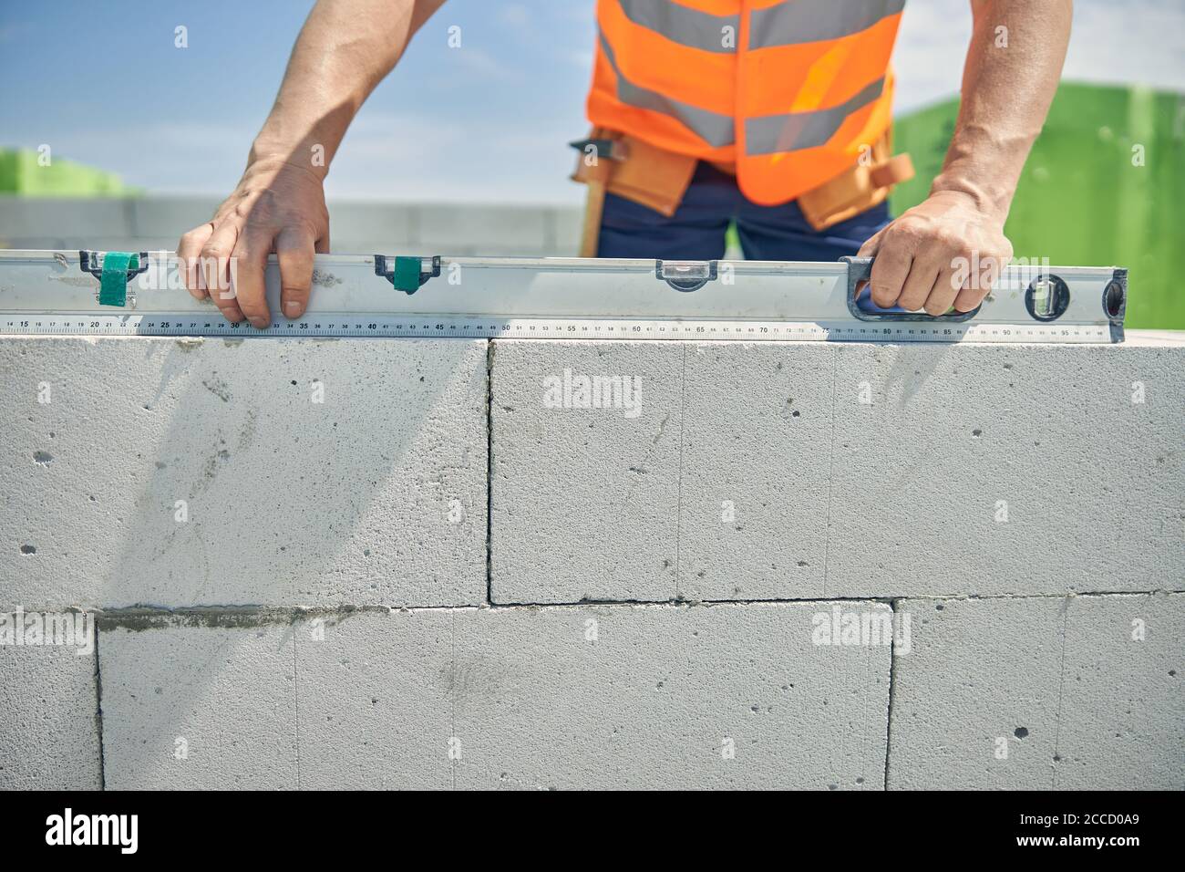 Skilled male worker using a spirit level Stock Photo