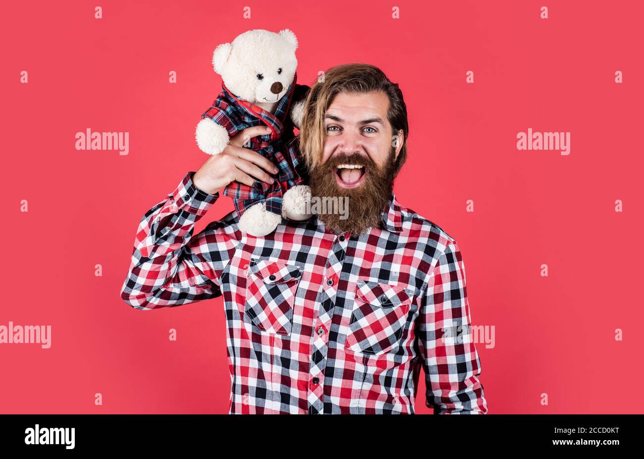 cheerful bearded man hold teddy bear. male feel playful with bear. brutal mature hipster man play with toy. happy birthday. being in good mood. happy valentines day. Valentines day sales. Stock Photo