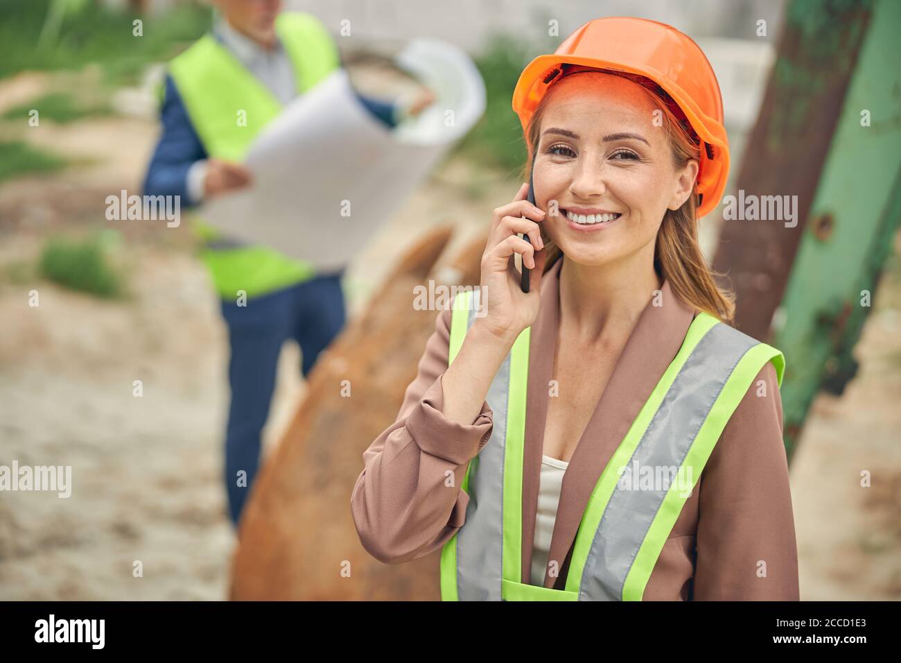 Cheerful lady calling on her cellular phone Stock Photo