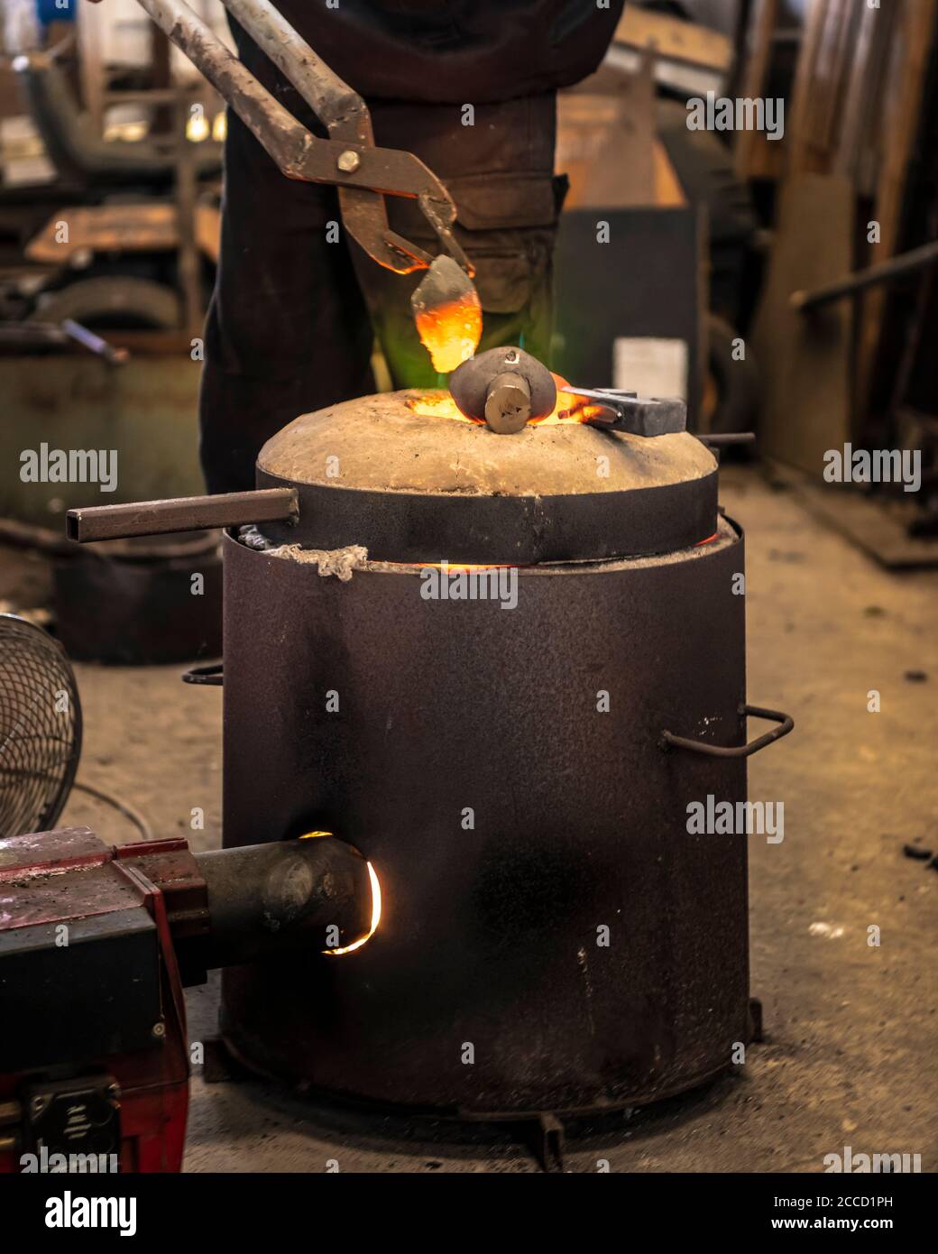 Casting the Bronze in small foundry. Sequence of images shows