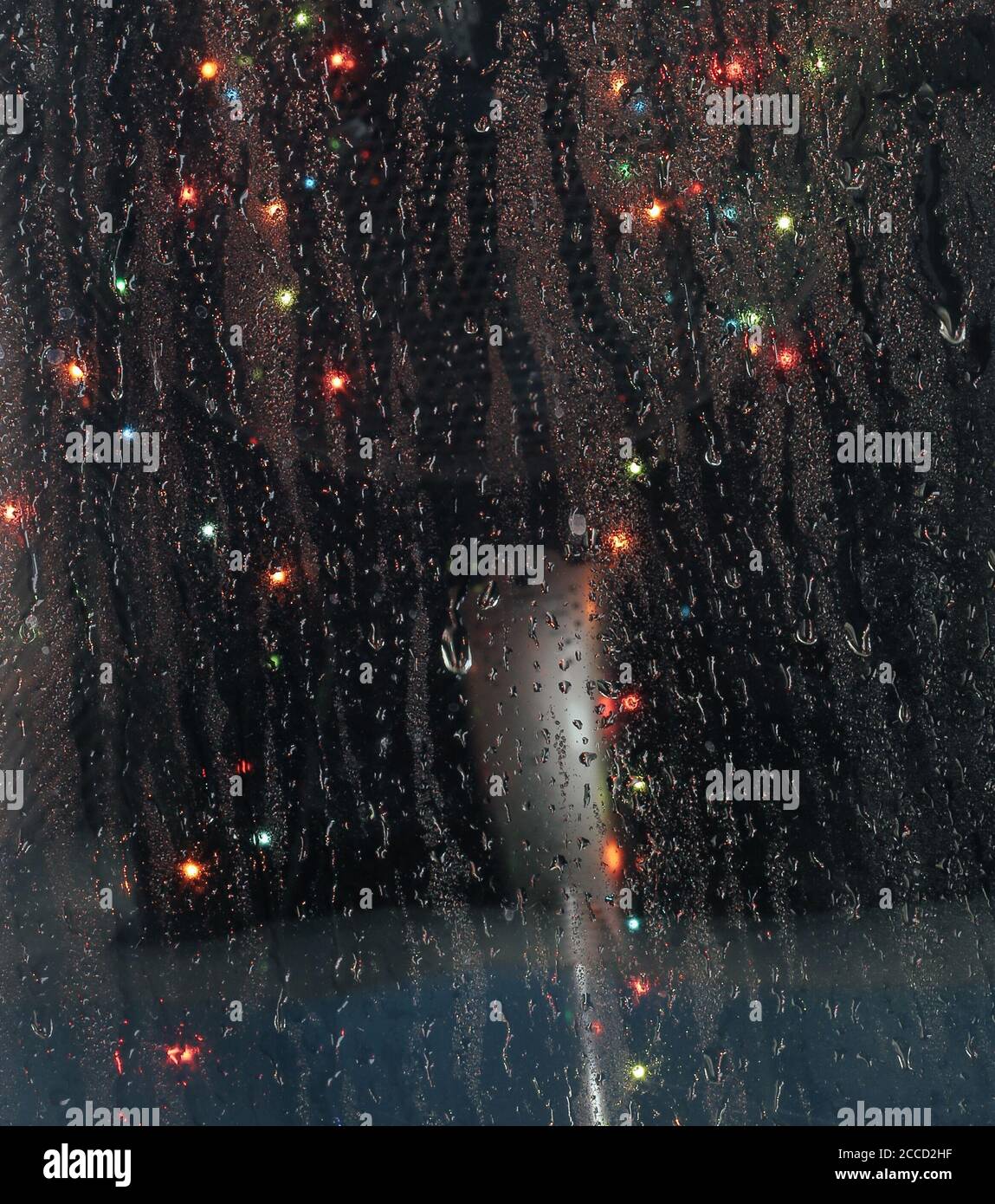 raindrops on the window with bokeh lights Stock Photo