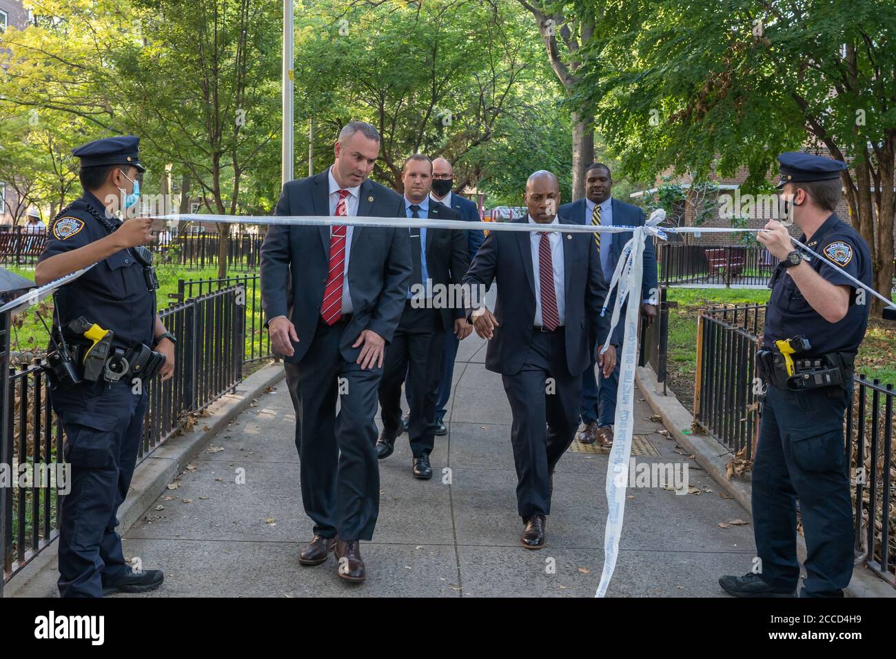 NEW YORK, NY AUGUST 18, 2020: NYPD Police Officers investigate a shooting at the Ravenswood Houses housing complex in Astoria. Stock Photo