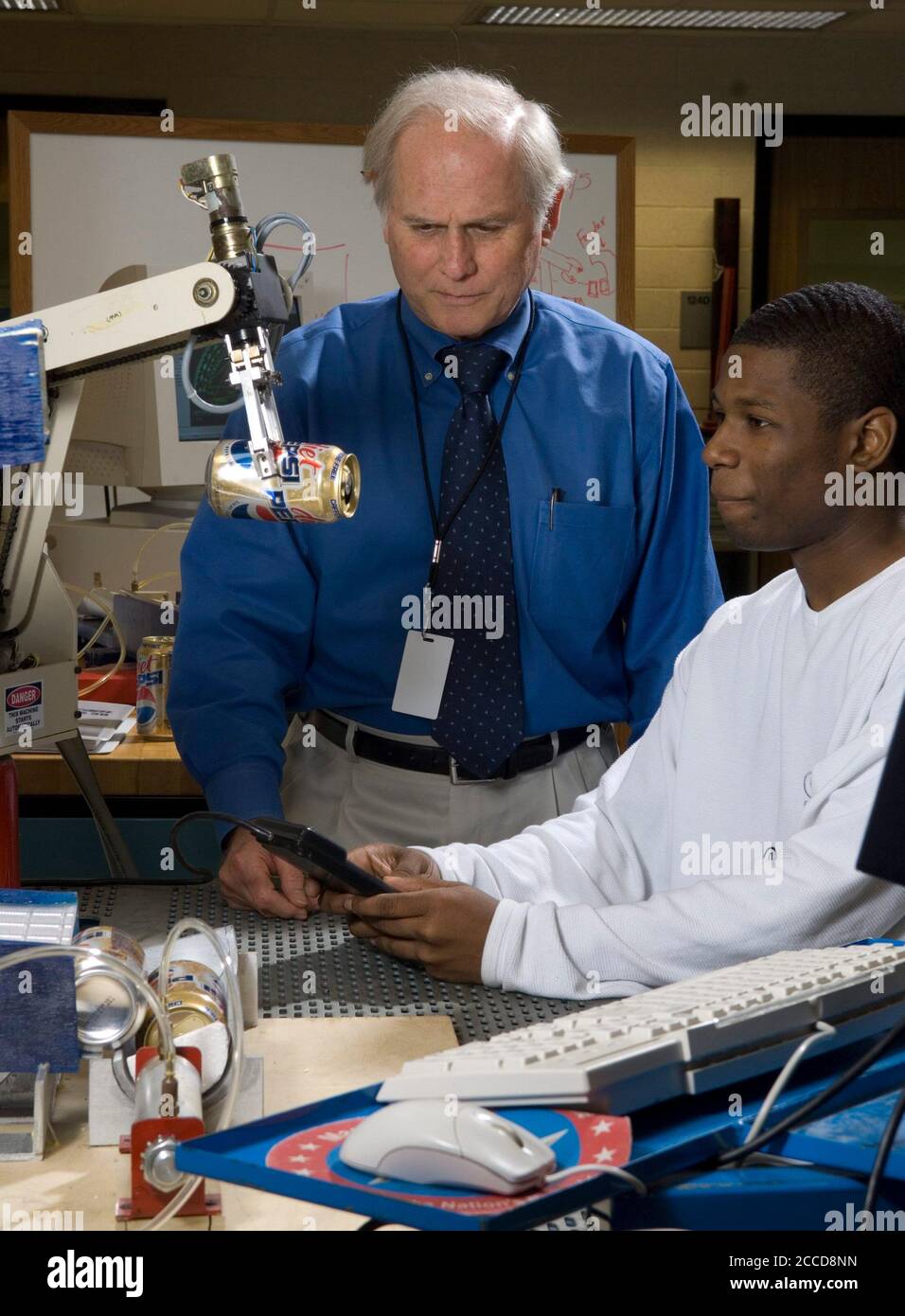 Houston, Texas March 5, 2007: Black male student and instructor demonstrate robotics at the George Washington Carver Magnet High School for science and technology in the Aldine school district of Houston.      ©Bob Daemmrich Stock Photo