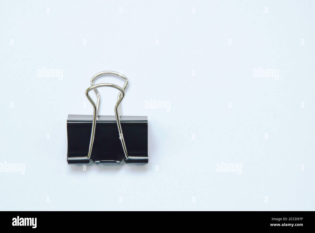 Black paper clip on white background Stock Photo Alamy