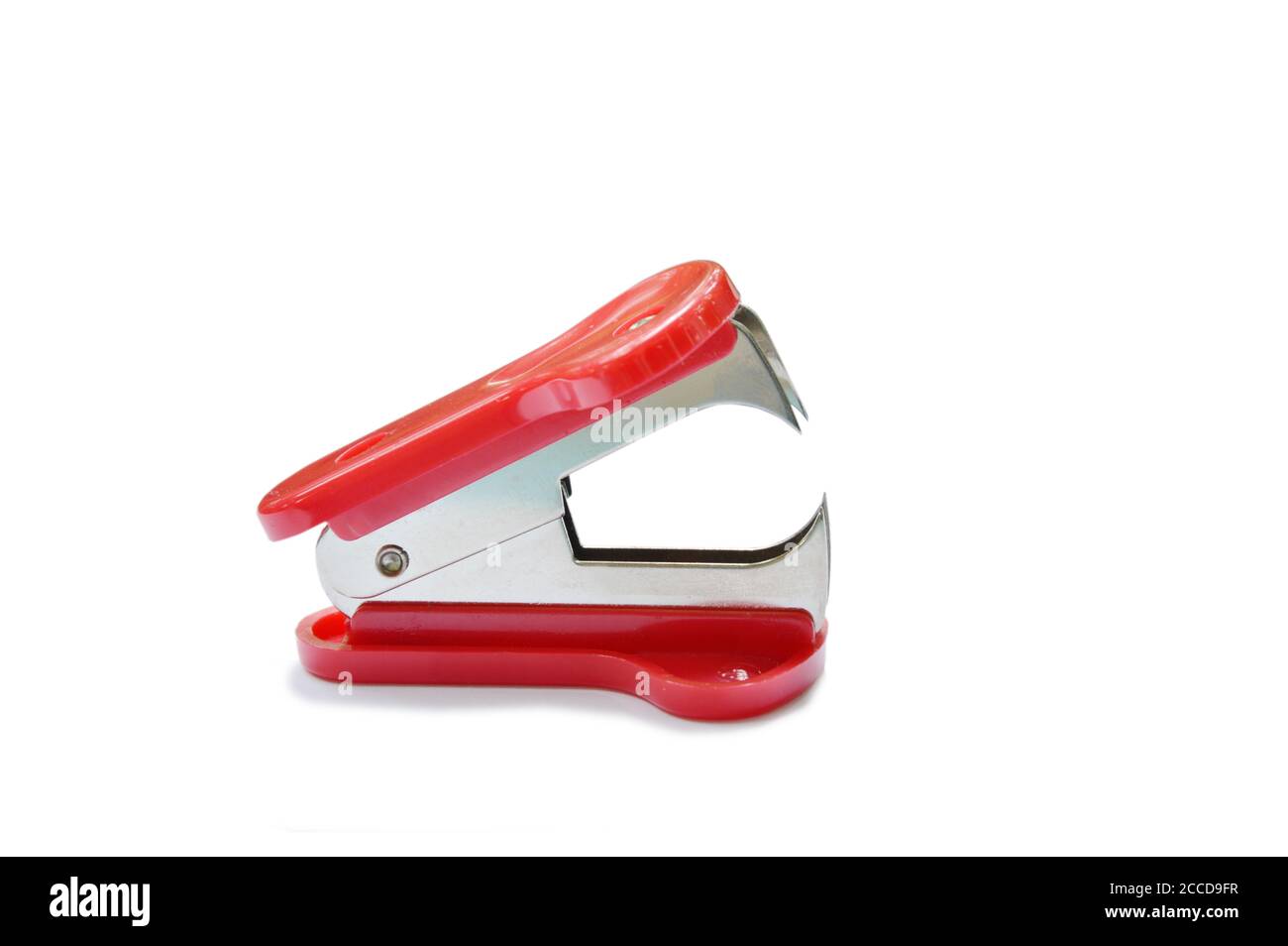 red staple remover and refill on white table Stock Photo