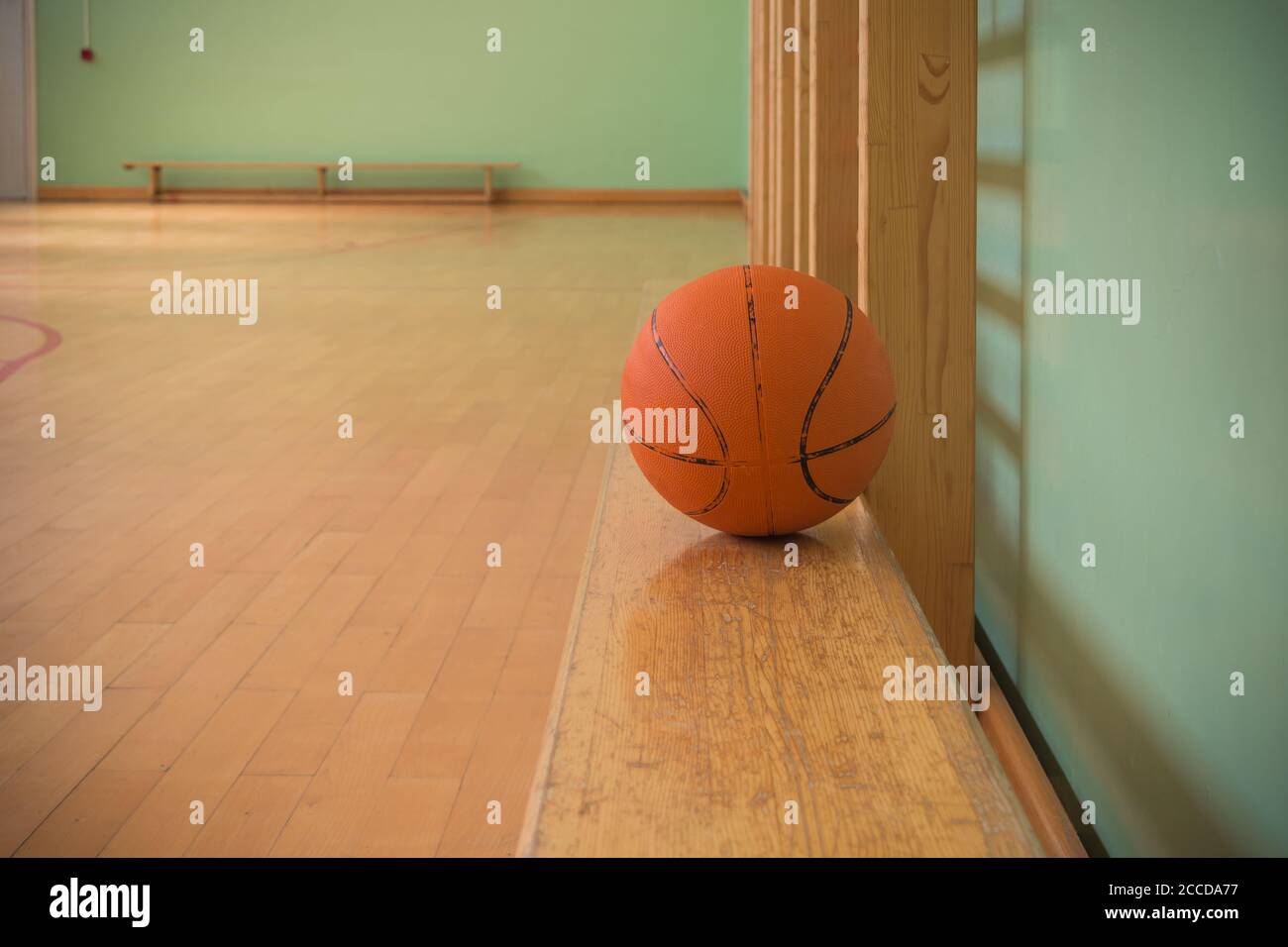 Empty old basketball court with benches and ball Stock Photo Alamy