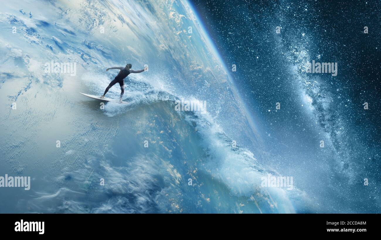 Man at one with nature surfing the world escape adventure concept Stock Photo