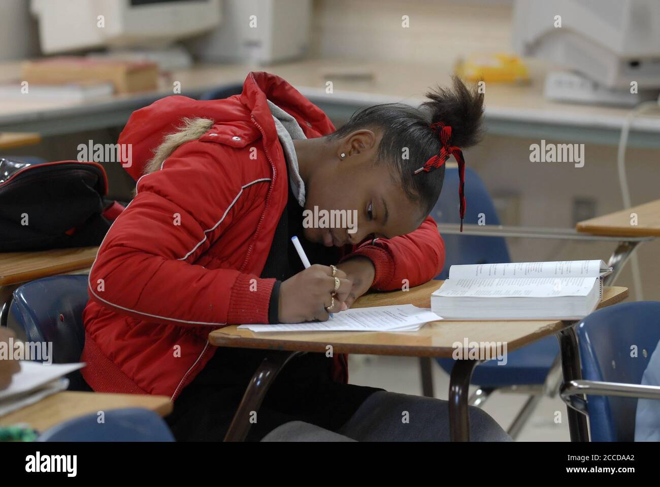 Fort Worth, TX USA,  December 1, 2006: Student in ninth-grade English class works on writing skills while developing a personal essay in class at Dunbar High School. For editorial/educational use only.   ©Bob Daemmrich Stock Photo