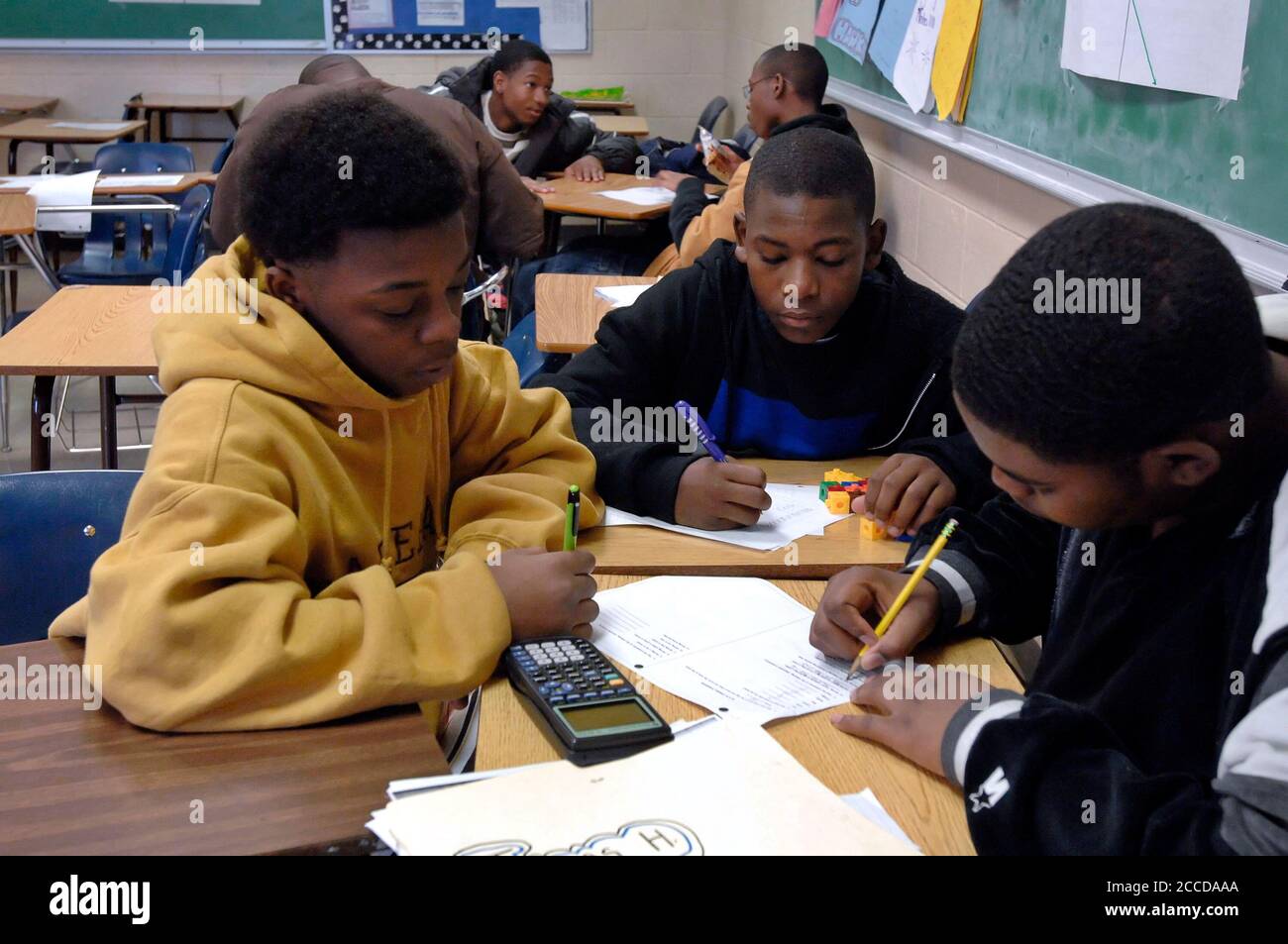 Fort Worth, TX December 1, 2006:  Ninth grade math students work on probability problems in class at Dunbar High School. ©Bob Daemmrich Stock Photo