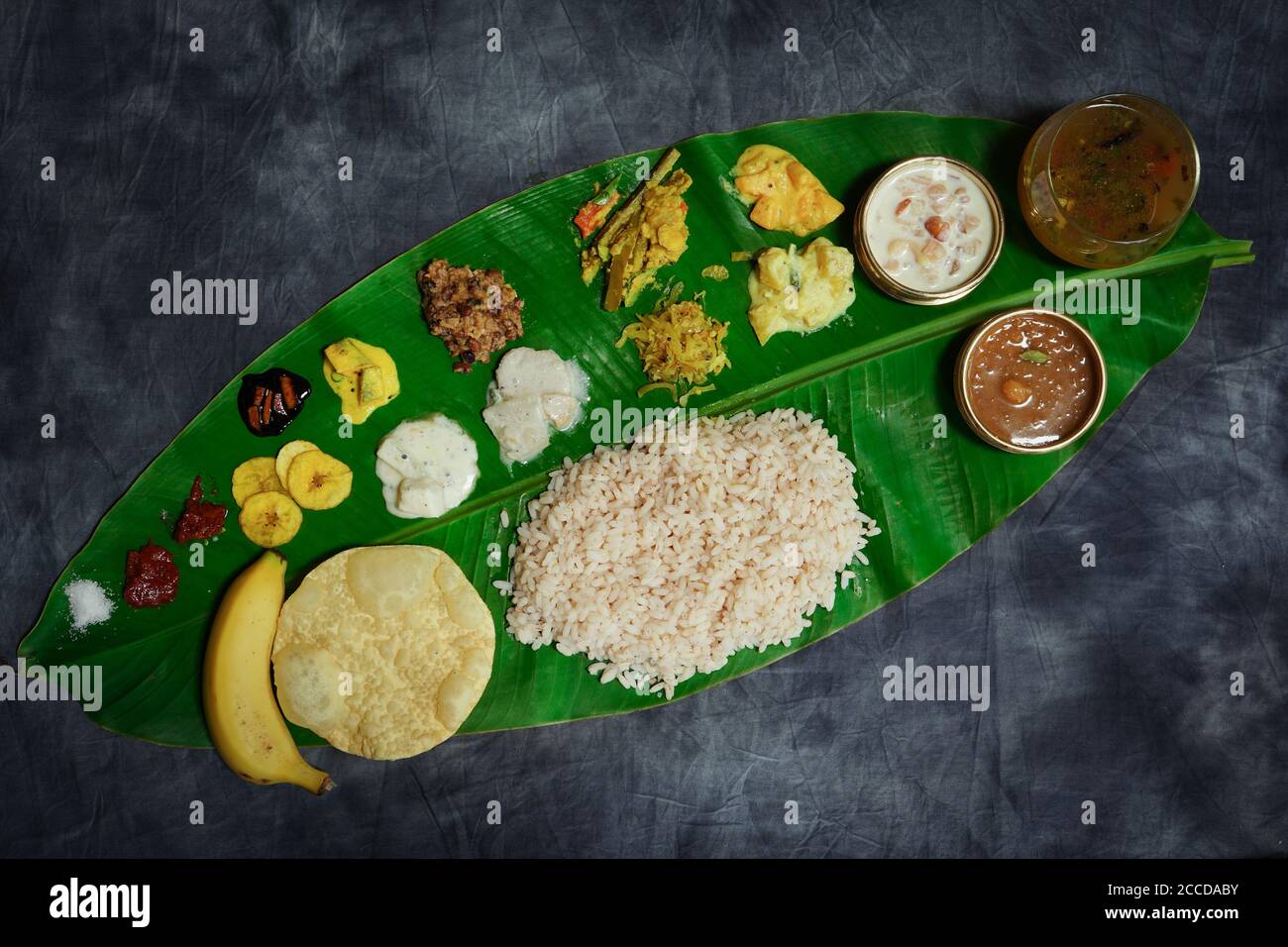 Onam feast / Kerala Ona-sadya served in banana leaf Stock Photo ...