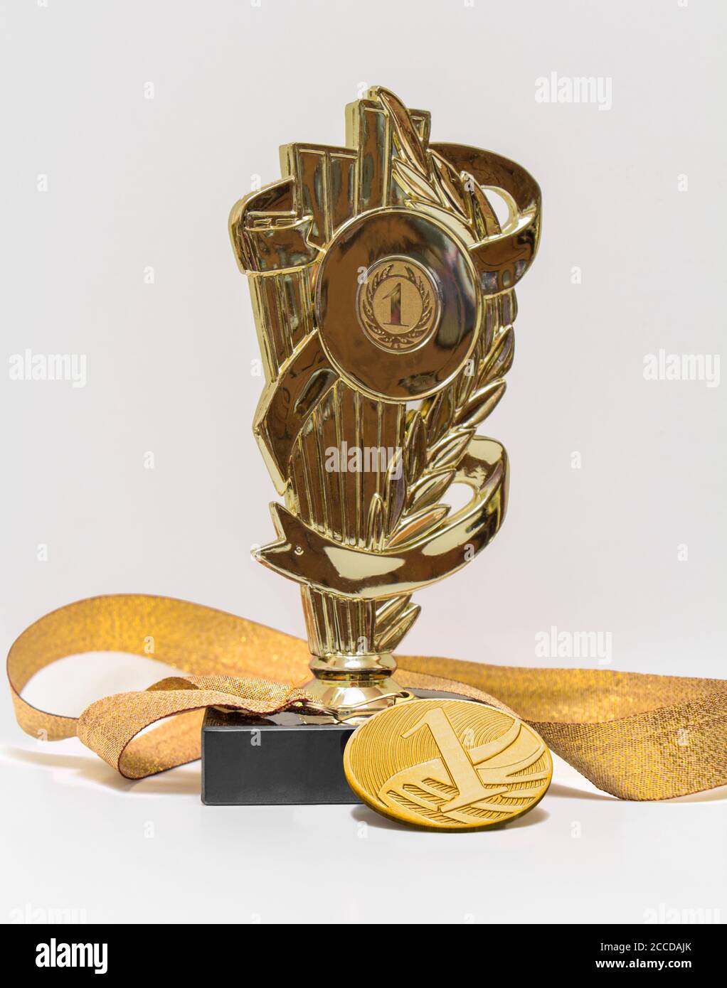 First place, cup and medal, isolated Stock Photo