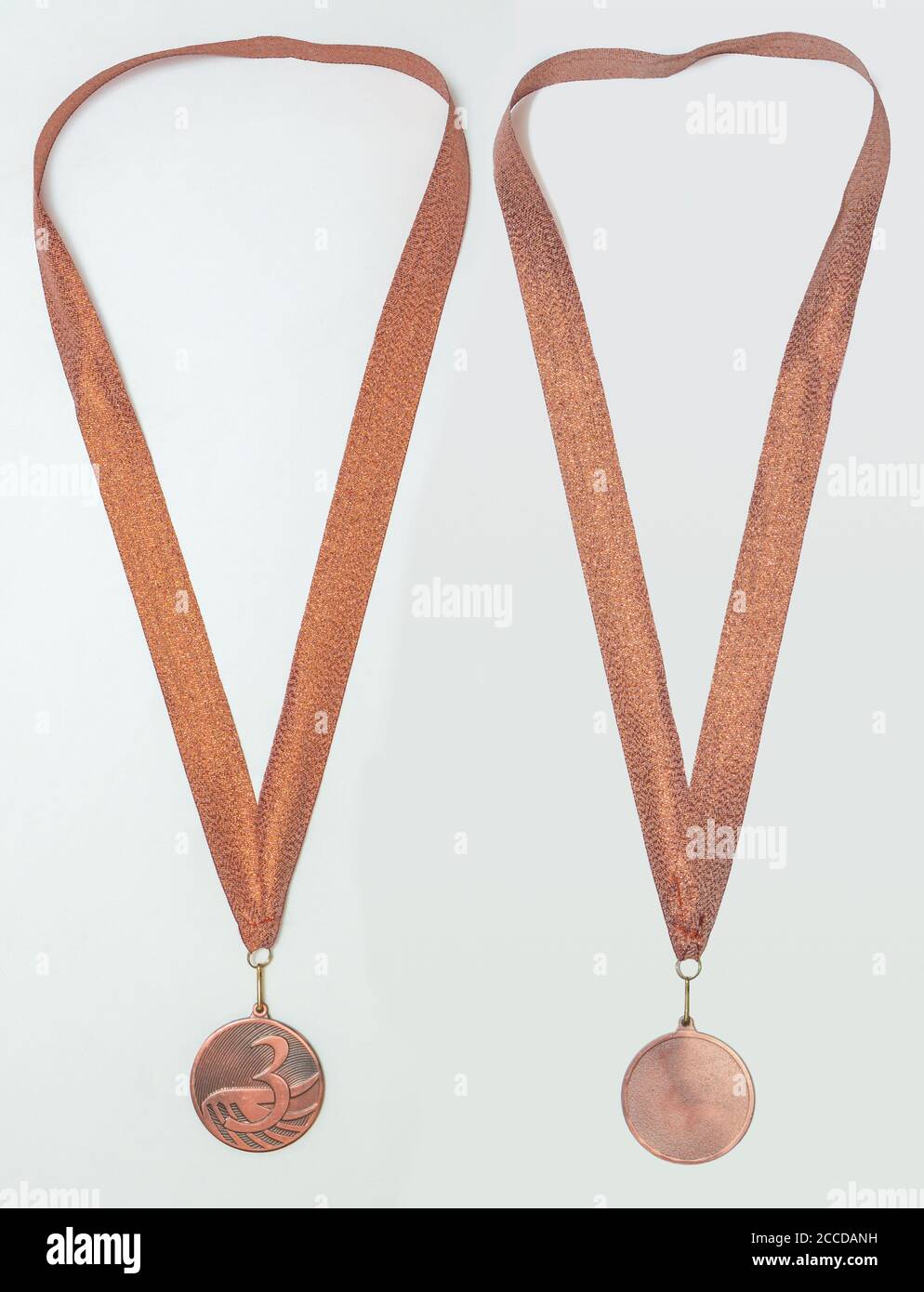 Bronze medal with ribbon, two sides, isolated Stock Photo