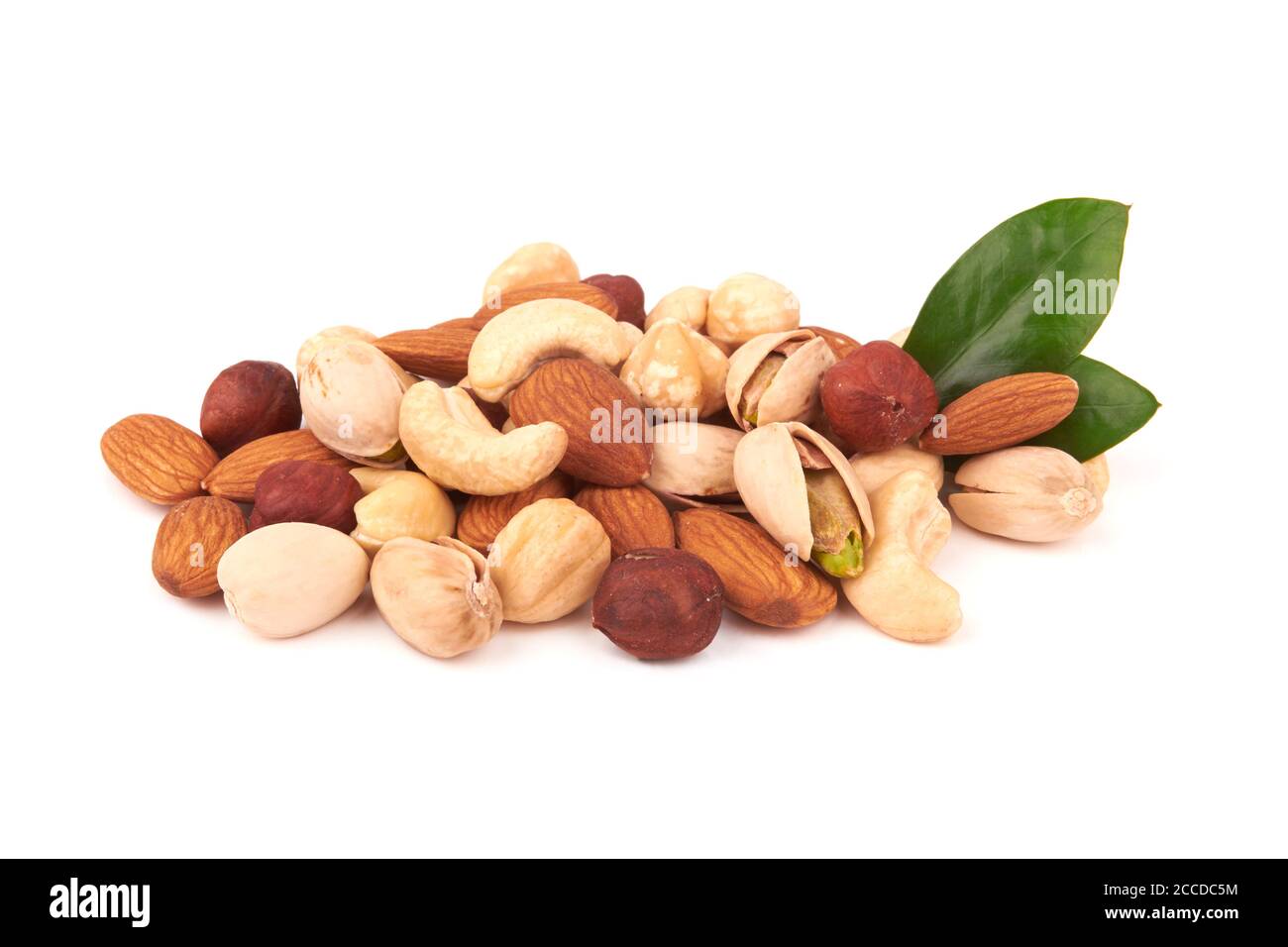 Heap of mixed nuts isolated on white background Stock Photo