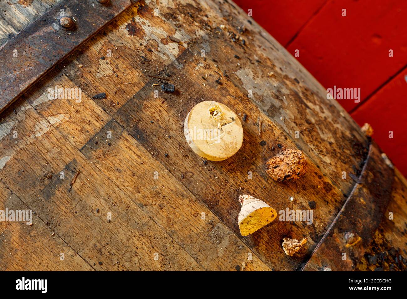 close up of  whisky barrel and bung stopper, on the top  of a dusty old whisky barrel. Stock Photo