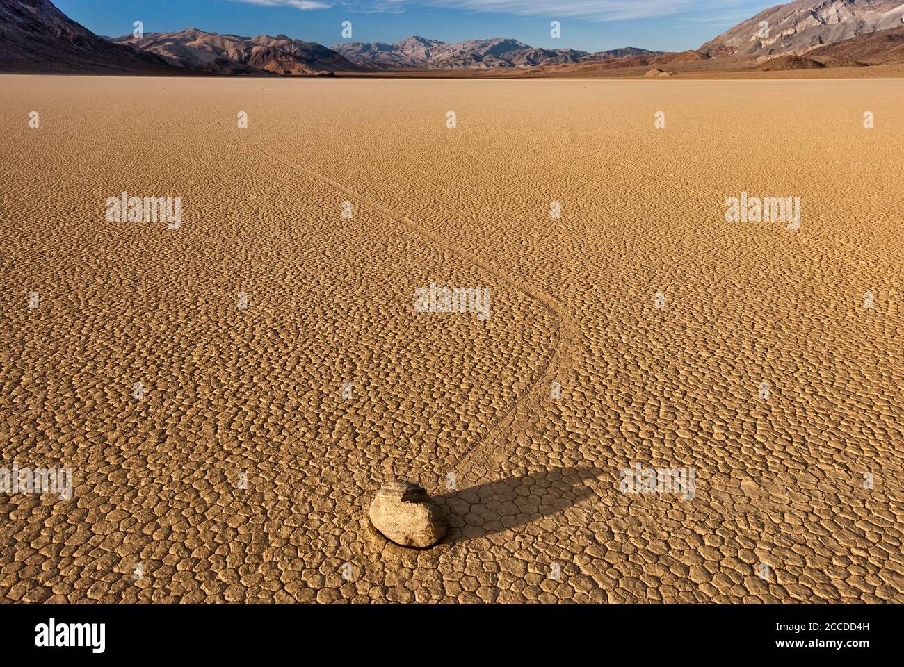 Moving rocks at The Racetrack dry lake, Mojave Desert in Death Valley ...