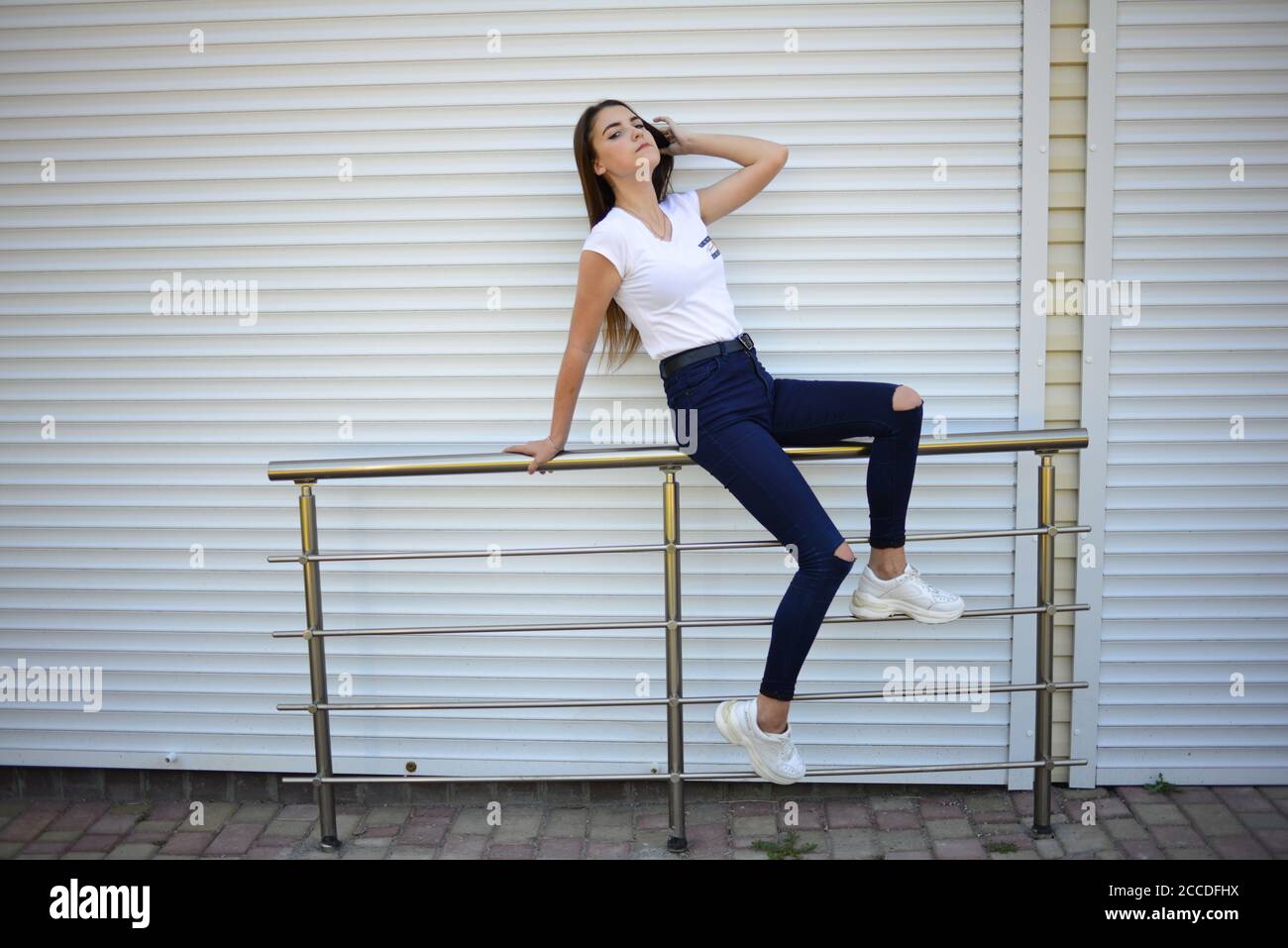 Beautiful girl wearing jeans shirt hires stock photography and images
