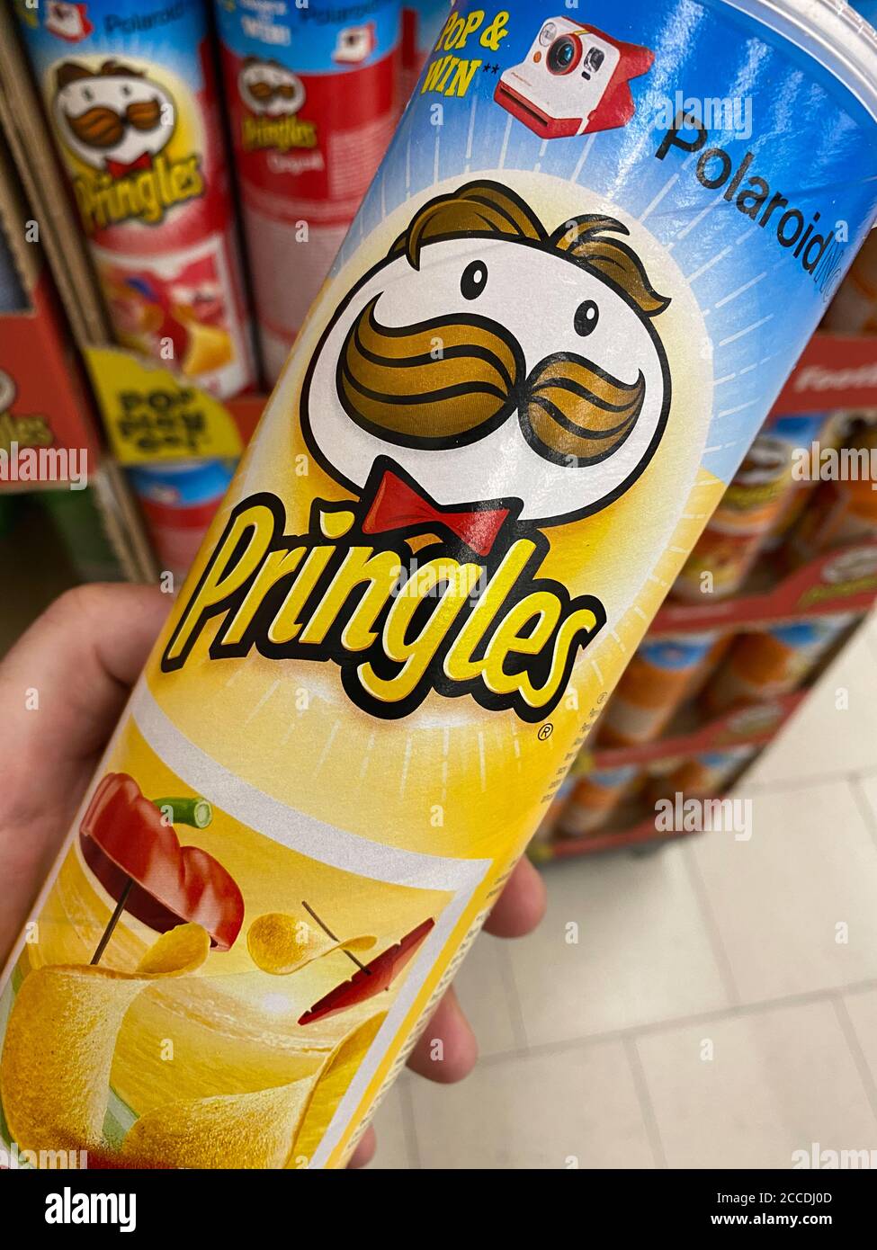Viersen, Germany - July 9. 2020: Closeup of box Pringles potato chips hold  by hand in german supermarket (focus on center of box Stock Photo - Alamy