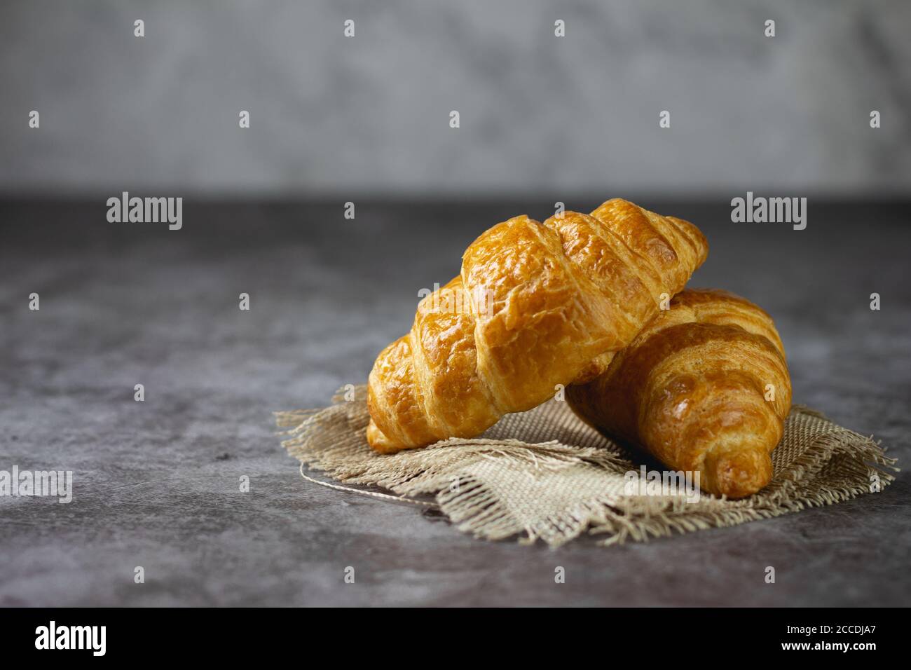 Tasty croissants on table Stock Photo