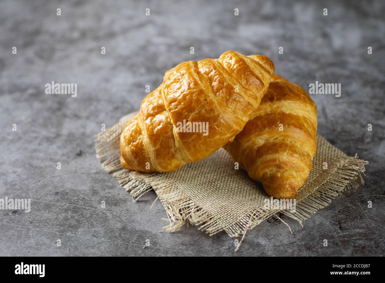 Tasty croissants on table Stock Photo