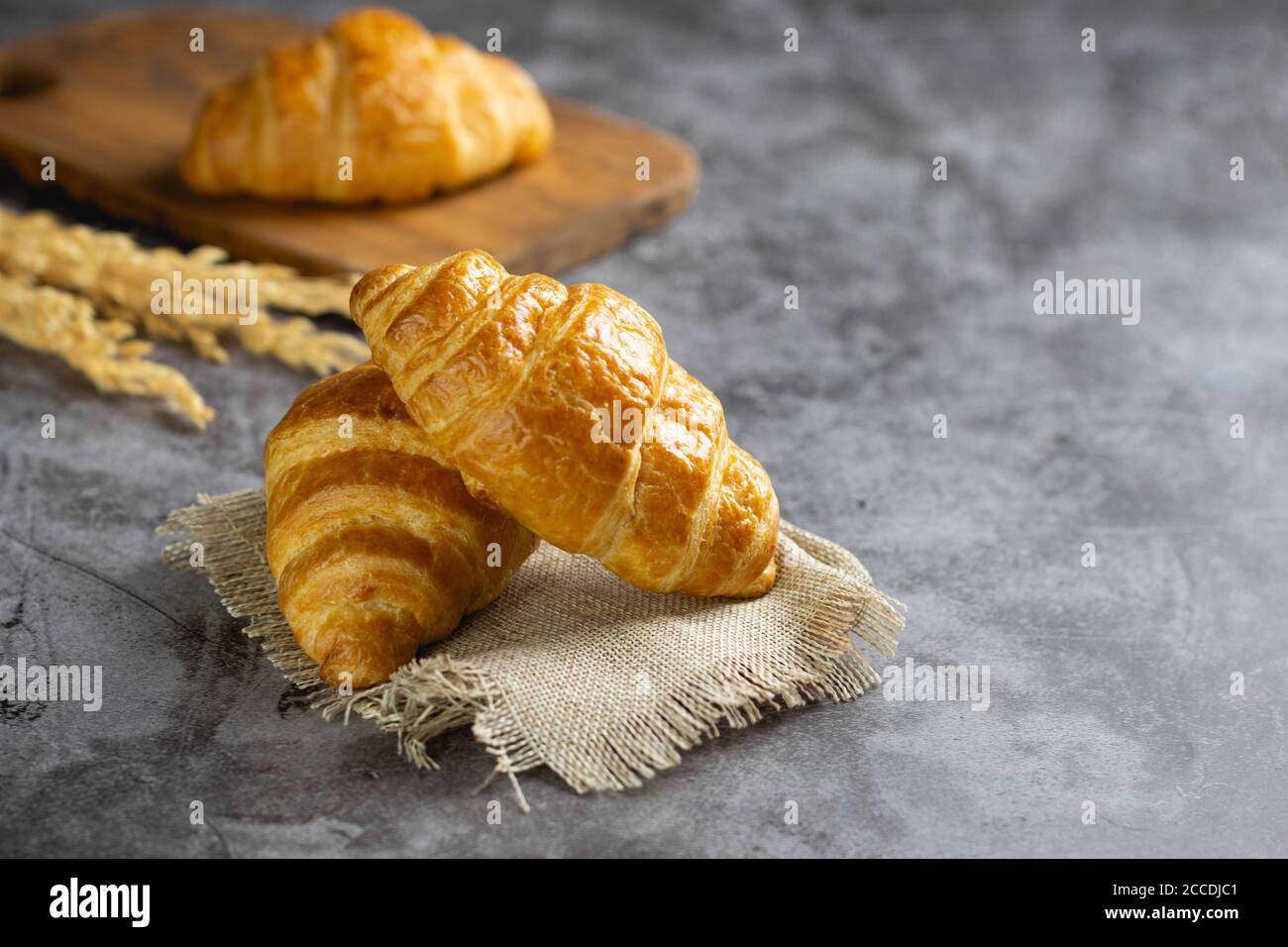Tasty croissants on table Stock Photo