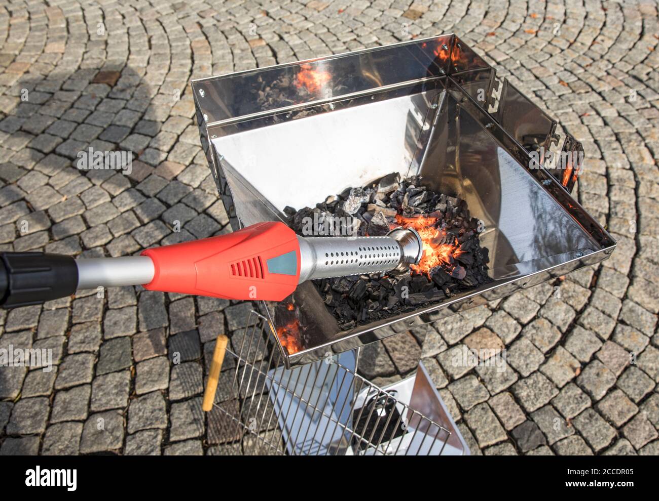 Thermo weed killer used for inflaming a barbecue Stock Photo