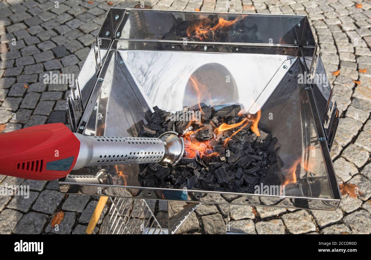 Thermo weed killer used for inflaming a barbecue Stock Photo