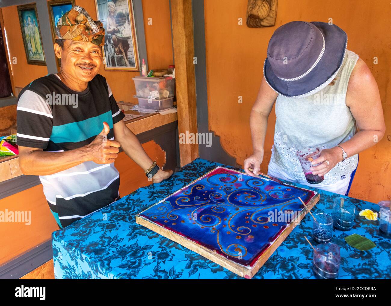 Batik is an traditional Balinese art technique of wax-resist dyeing applied to whole cloth. This technique originated from Java but has become popular Stock Photo