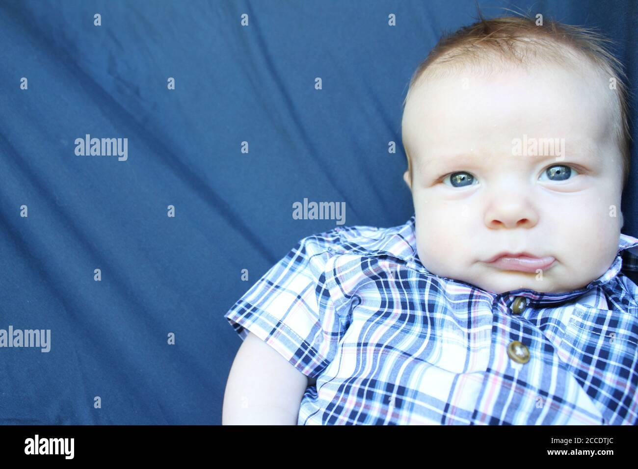 Photo of a redheaded blue eyed baby boy. Stock Photo