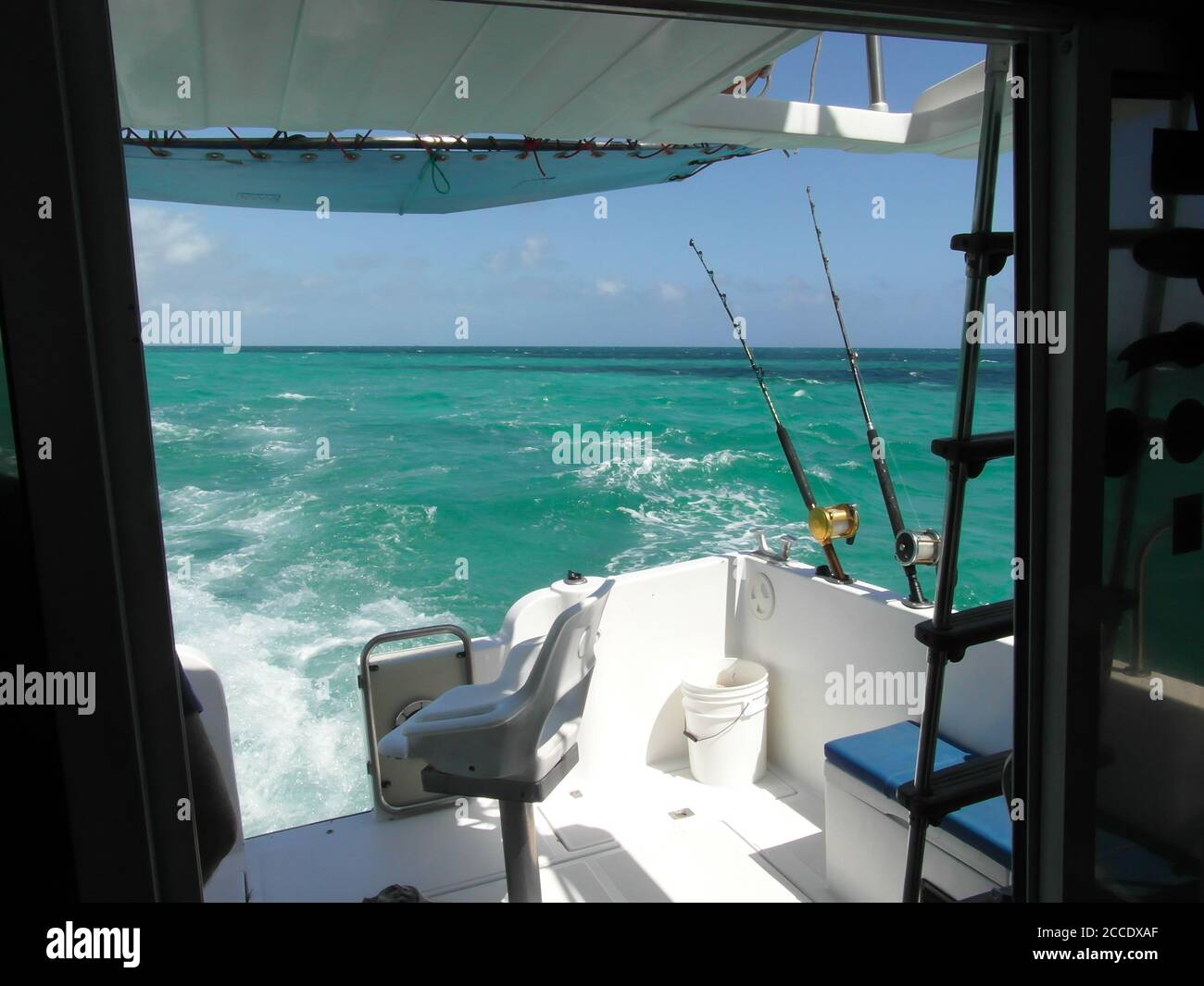 Sea fishing from a boat along the coast of Cuba with bright blue sea and sky Stock Photo