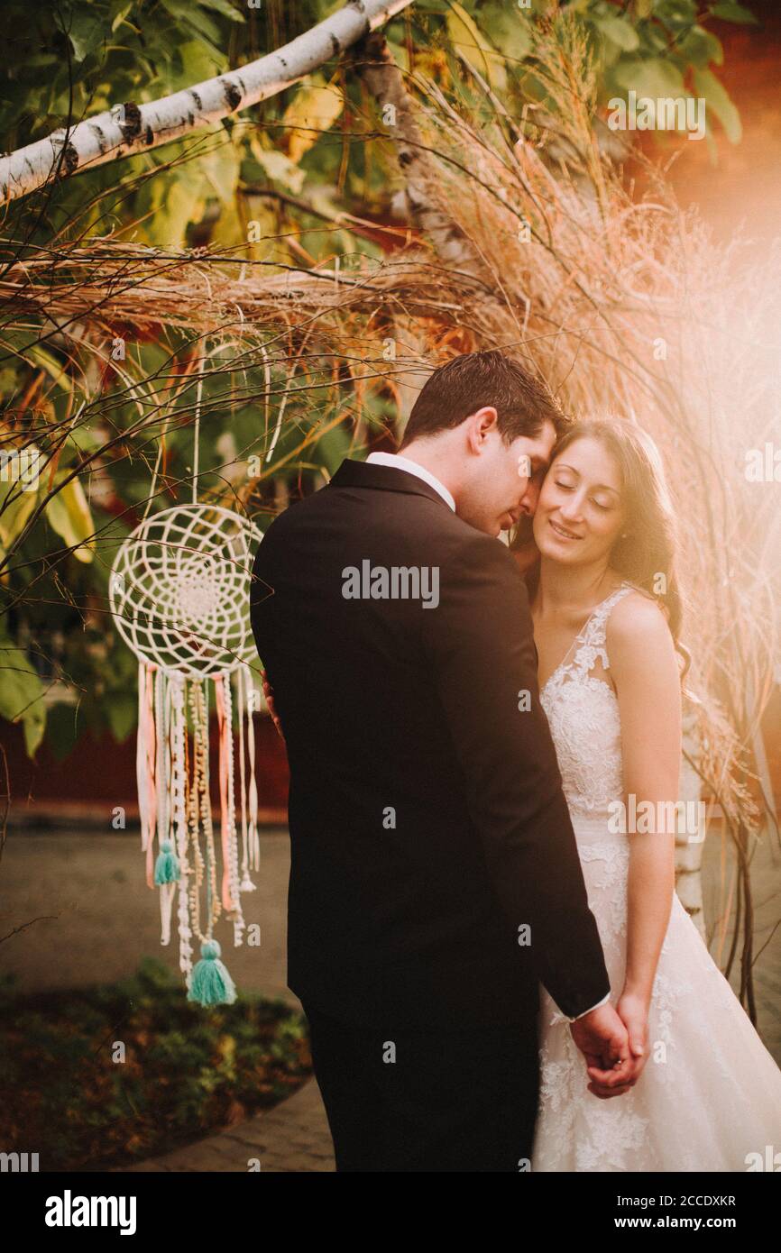 Happy newlyweds holding hands hi-res stock photography and images - Alamy