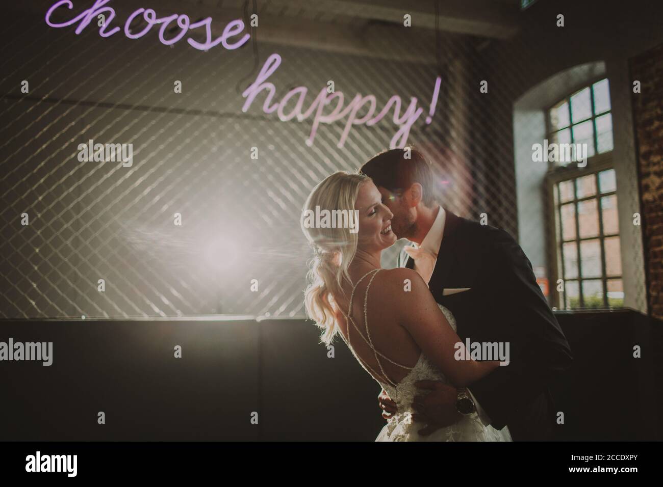 Happy newlyweds kissing indoor hi-res stock photography and images - Alamy