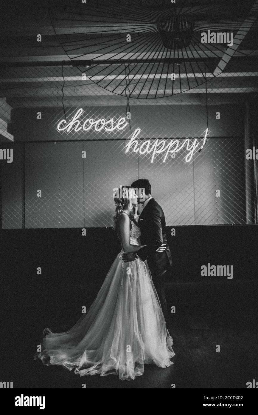 Happy newlyweds kissing indoor hi-res stock photography and images - Alamy